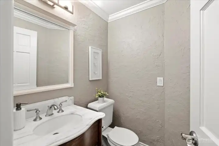 Main floor powder room with new vanity and Calcutta marble counter.