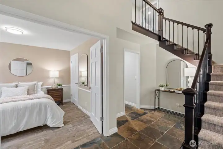 The main floor bedroom is perfect for guests or use as an office/den or music room.