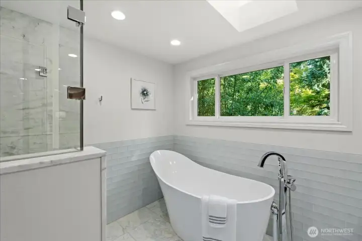 Soak away the day in this Victoria + Albert volcanic limestone Almalfi slipper tub. This bathroom will not disappoint!