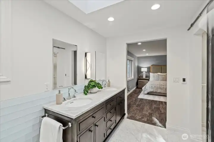 Another view of the custom vanity with interior electrical outlets, Robern medicine cabinets/mirrors with storage and a Hubbardton forge lighting sconce.