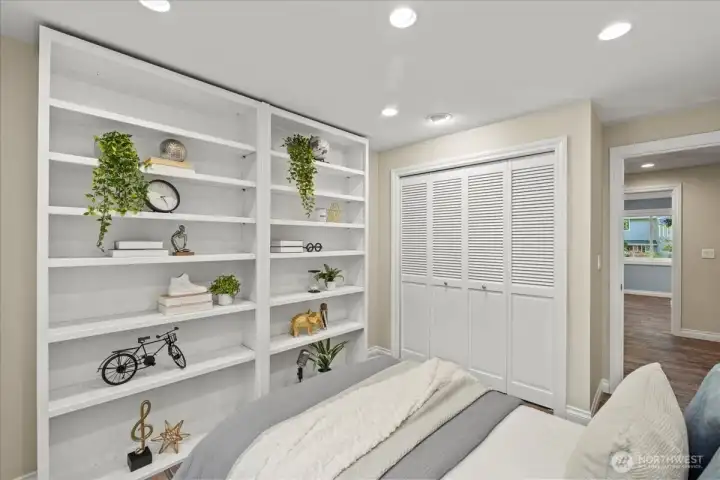 Bedroom #4 has beautiful built-in shelving that stays with the home.