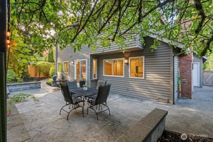 Relax and enjoy privacy on your stamped concrete patio with raised planter beds. The fully fenced backyard features a new fence, mature landscaping, grapevines, Asian pear tree, fig tree and lace leaf maple tree.