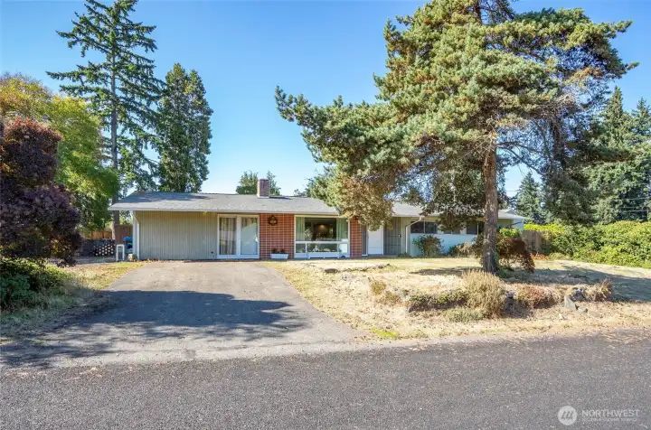 Rambler single story home on corner lot