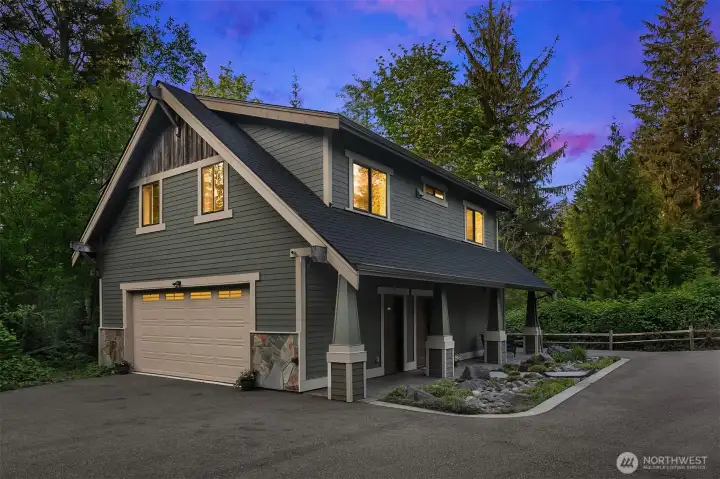 4 car drive through 1200sf detached shop with utility sink.  1080 sf 1-bedroom MIL upstairs with private entrance.