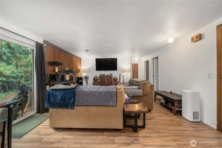 Unit 1 Central gathering area with entertainment wall and multiple lighting points for bright and functional living. Wide layout offers multiple furniture placement options for work or relaxation.