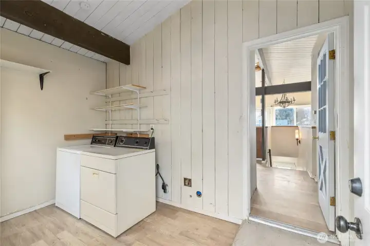 Combined mud and laundry room located off the kitchen hall.