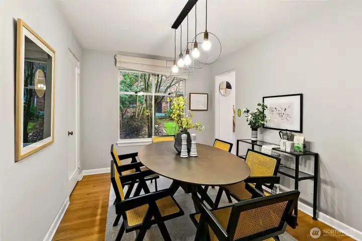 Charming dining area with updated lighting.