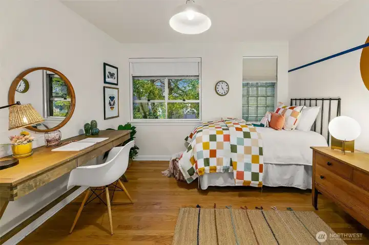 One of two bedrooms on the 2nd floor. Both features restored original hardwood floors.
