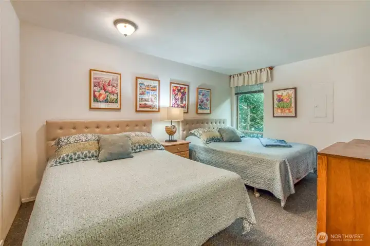 The second bedroom accommodates four guests.