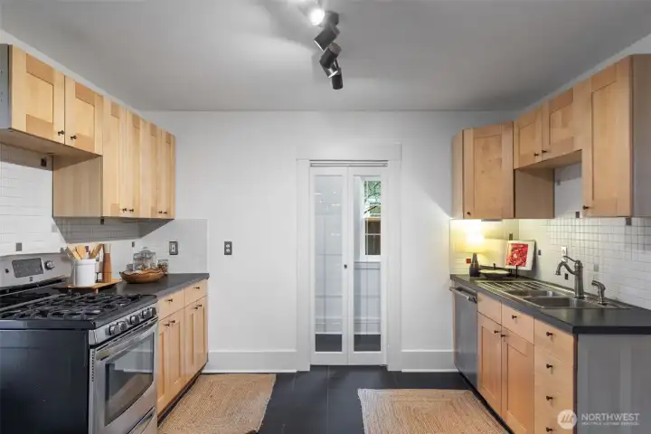 Walk-in kitchen pantry. Plenty of storage for your countertop appliances, dry goods rubbish bins, vacuum, etc.