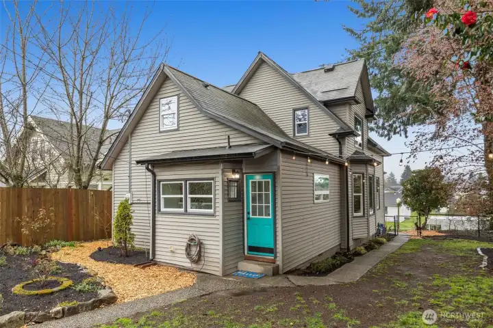 Fully fenced backyard with a dog run.