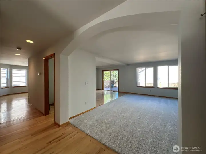 Entry - maple floors lead to newly carpeted living room
