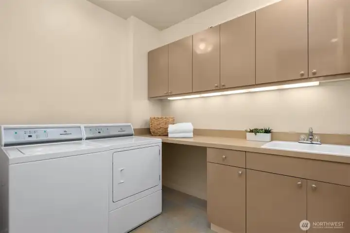 Main floor laundry room with utility sink
