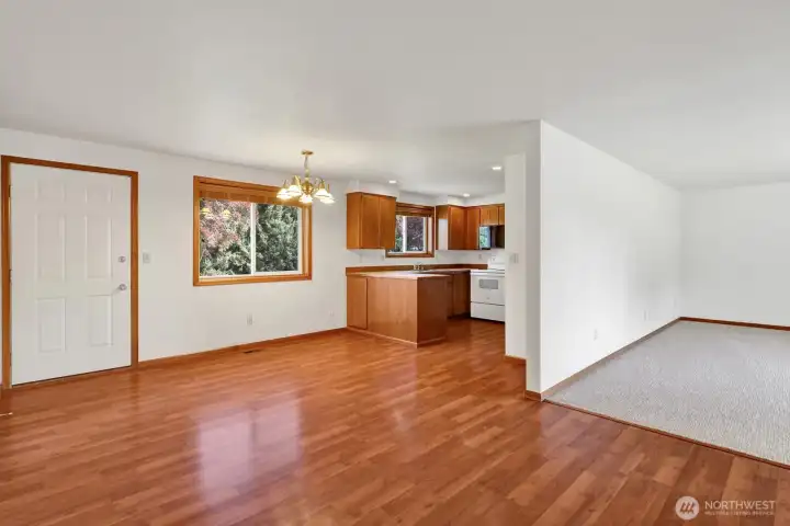 With laminate floors, backyard access, and an open connection to the kitchen and living room, this dining space offers both function and flexibility.