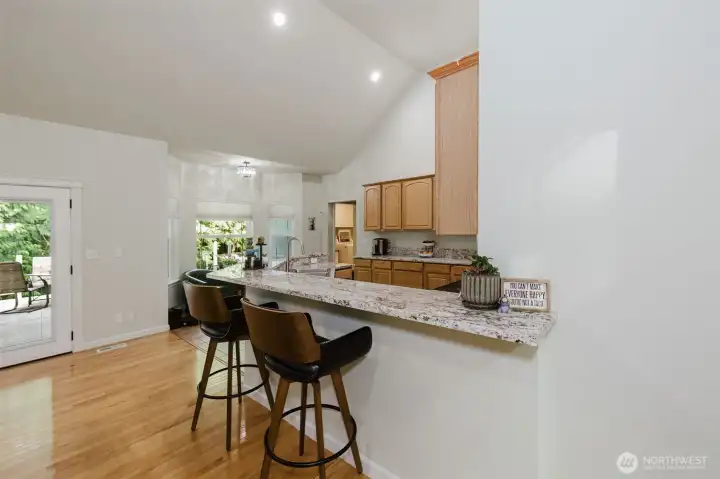 Breakfast bar in kitchen is expansive and wraps around.