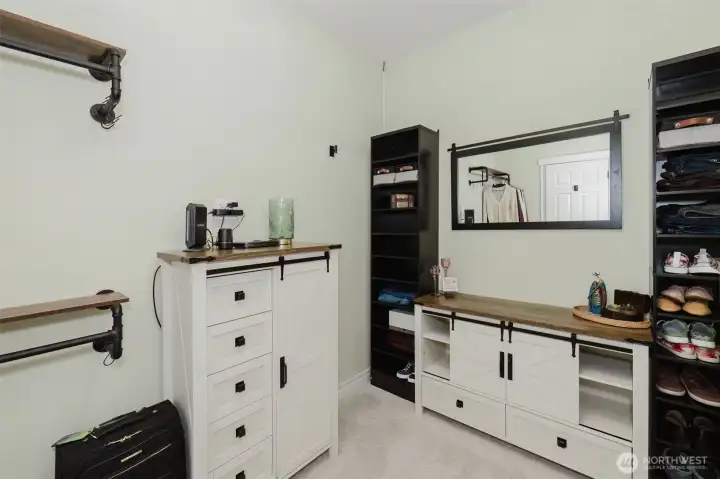 Primary walk-in closet includes brand new organization system.