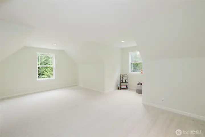 Bonus room above the garage with new carpet and fresh paint has endless possibilities.