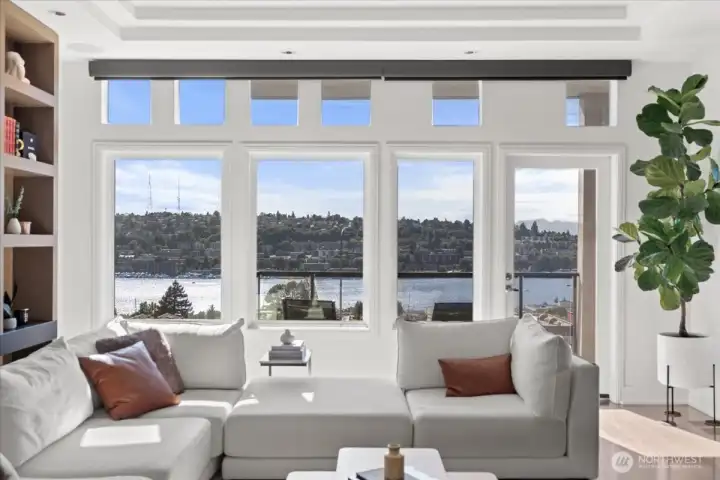 Walls of windows frame unforgettable vistas, offering front-row views of Seattle’s iconic skyline and Lake Union.