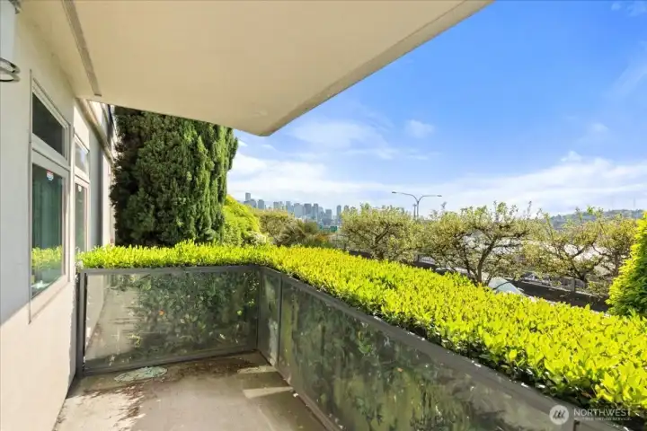 Experience peaceful mornings and glowing city evenings from the primary suite