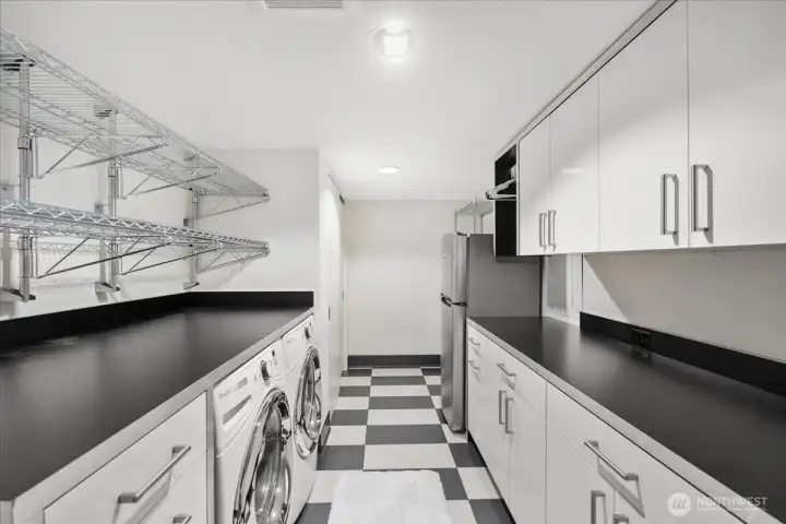 Spacious utility and laundry room with extensive cabinetry