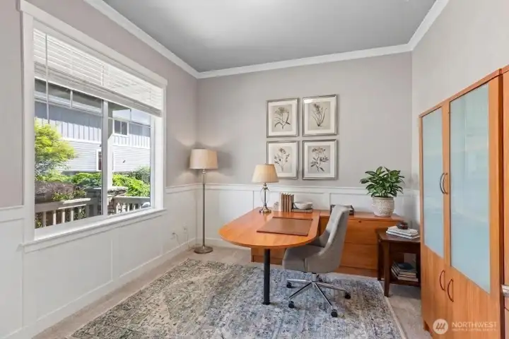 Spacious home office (some items digitally staged). Desk and storage cabinet are negotiable.