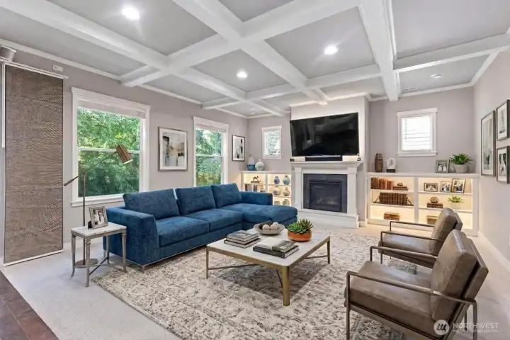 Amazing living room with box beam ceilings, gas fireplace, built-in bookshelves. *Some decor digitally staged.