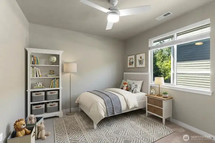 Bedroom 1 of 4 on second floor with ceiling fan. *Decor is digitally staged.