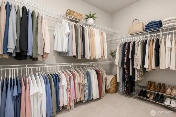 Primary walk in closet has a TON of great storage! *Some decor digitally staged.