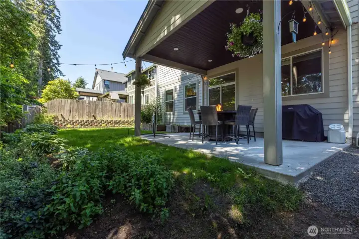 Mature landscaping and a couple of raised garden beds make this a peaceful retreat.