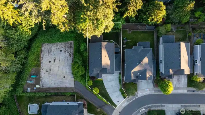 Drone shot of corner lot. The space to the left of home is underground storm water retention, so you will never have a neighbor to the left.