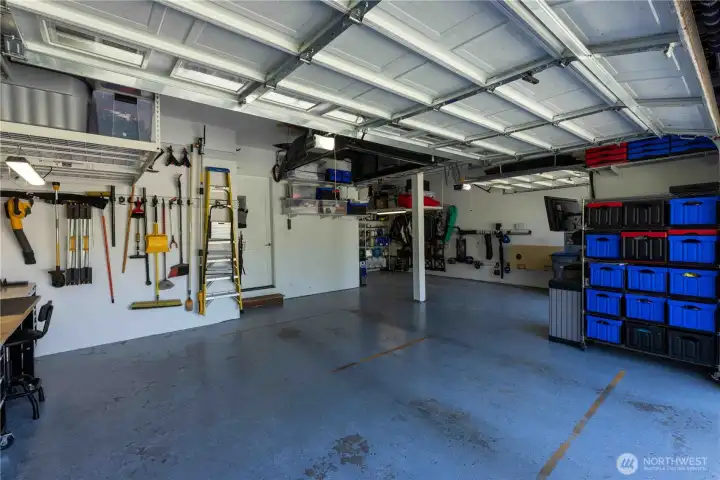 3 car garage with extra deep bay for addtional storage. Overhead storage racks stay!