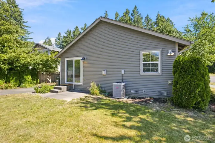 Rear of home showing A/C unit