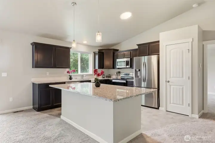 Open to the main living spaces and full of natural light & abundant counter space