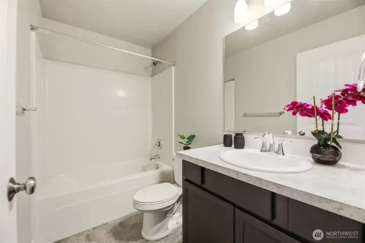 Full main bath with tub and shower combo
