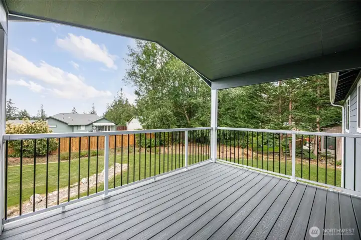 Covered back deck to protect from hot days or rain with partial mountain views on clear days