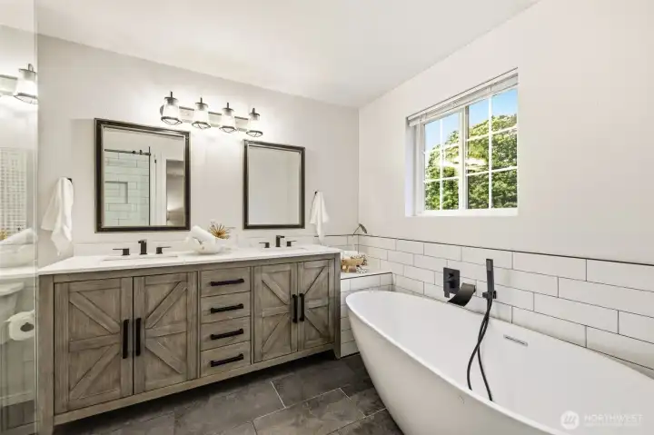 Recently updated bathroom with dual sinks, soaking tub, and shower. Recently updated bathroom with dual sinks, soaking tub, and shower.