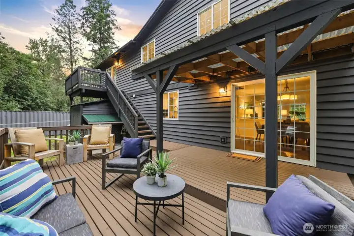 Large outdoor patio. Notice the large shed under upper deck. Large outdoor patio. Notice the large shed under upper deck.