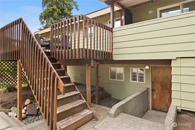 The back deck stairs and entrance to the lower level.