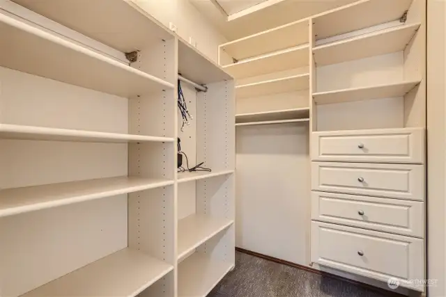 Another walk-in closet with custom shelving.
