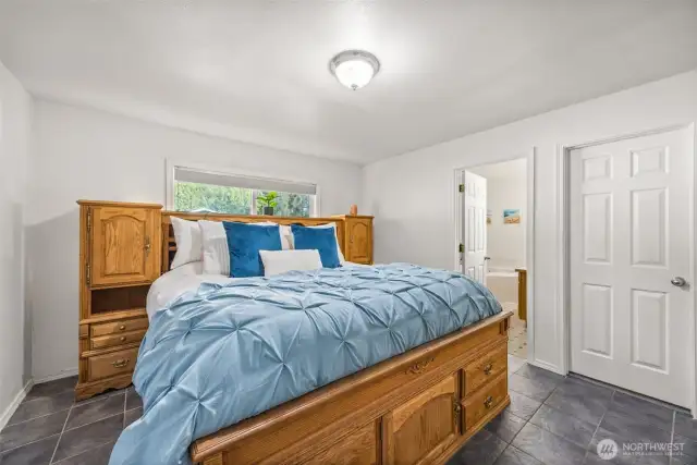 Primary bedroom with walk-in closet and 5 piece bathroom en-suite