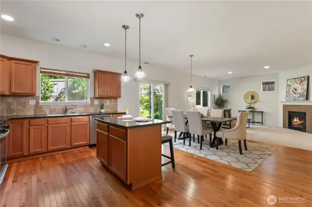 Open concept layout features a large kitchen, dinning and family sapce.