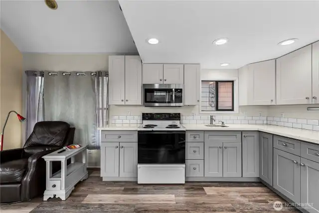 The updated kitchen has lots of counter space and storage