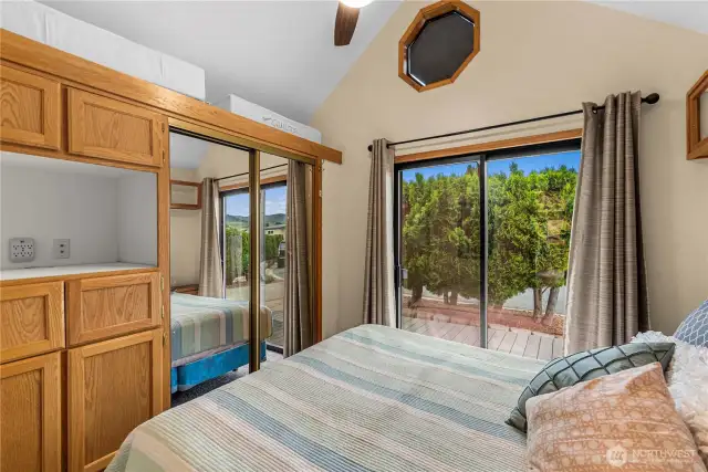 The bedroom has lots of built in storage.  This is a queen bed.