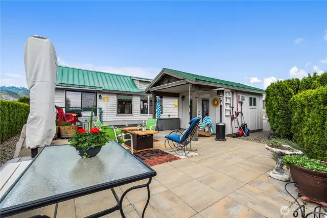 The photographer is standing in the break in the hedge, which leads to Singleton Park with 5 pickleball courts, basketball, baseball, playground, and much more!