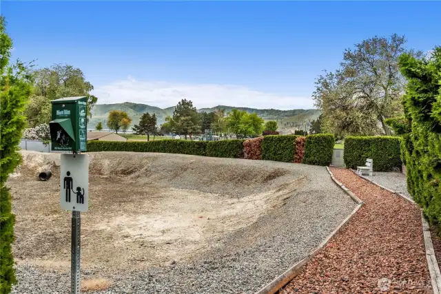 This is the path most VDL folks take to get to the park.  (There is an opening in the hedge by the bench for lot 33 for quicker access to the park.)
