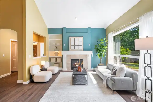 The family room is adorned with a cozy gas fireplace and a custom built-in.