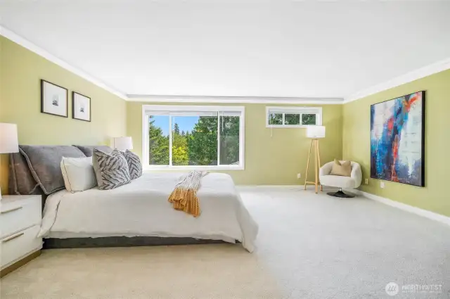 The primary bedroom is oversized with space for a sitting area.