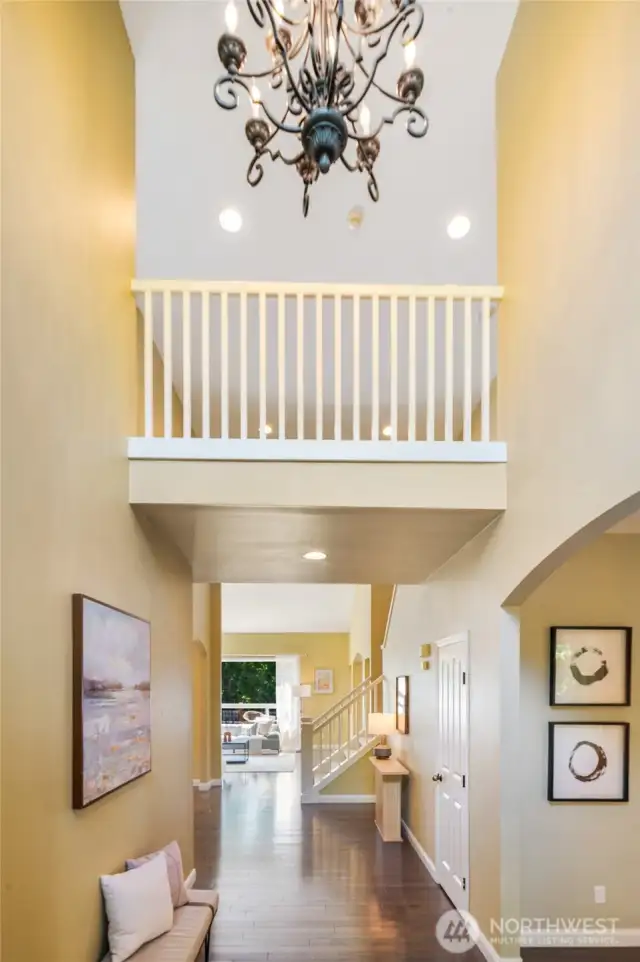 Soaring entry with gleaming floors that flow throughout the main living areas.