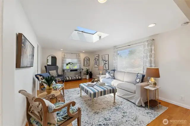 Formal living area with large skylight that opens to allow a natural breeze through the home.