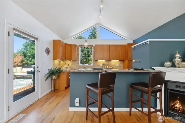 Kitchen with breakfast bar. Door on the left allows access to entertainment sized deck.